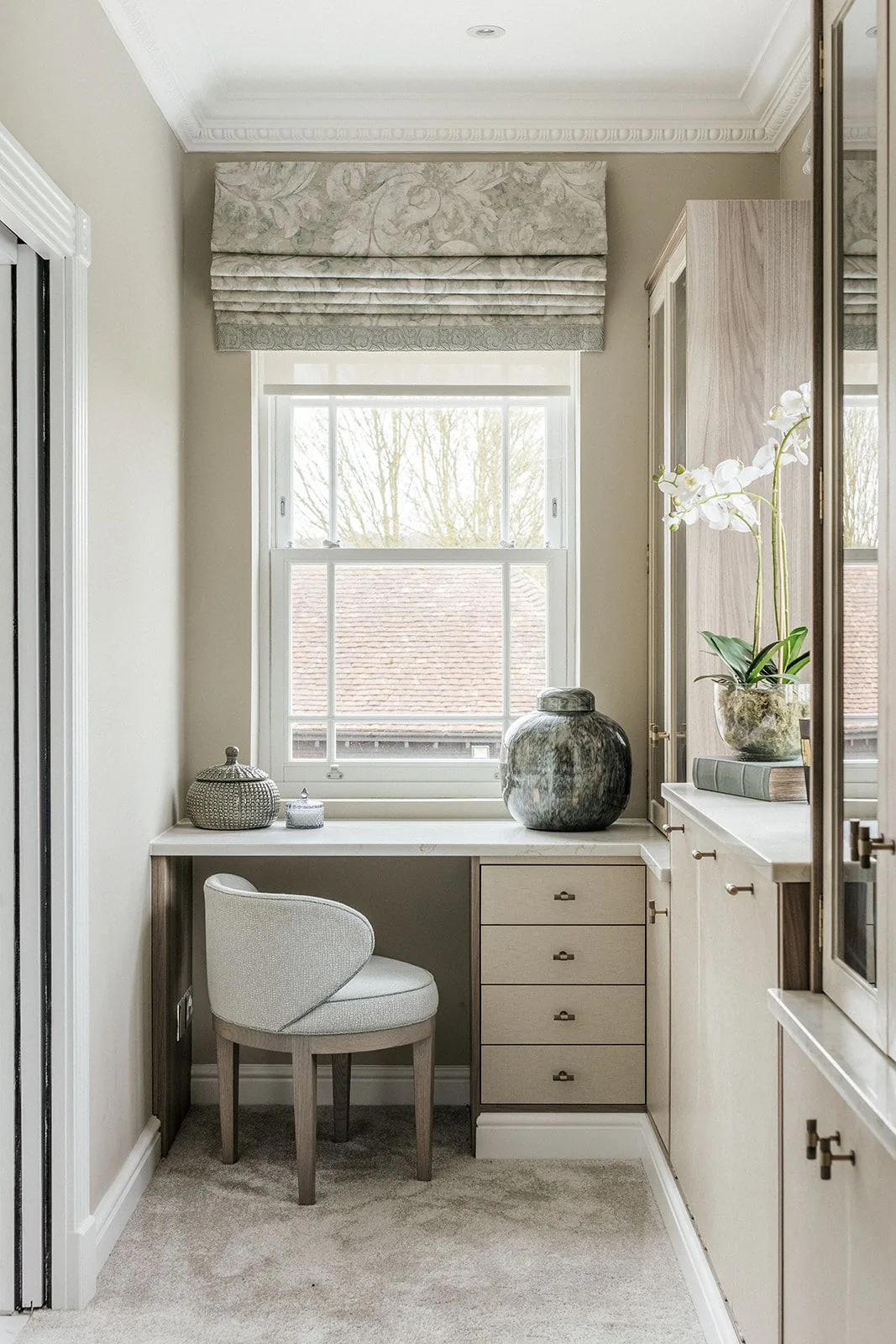Bespoke dressing vanity with orchid arrangement
