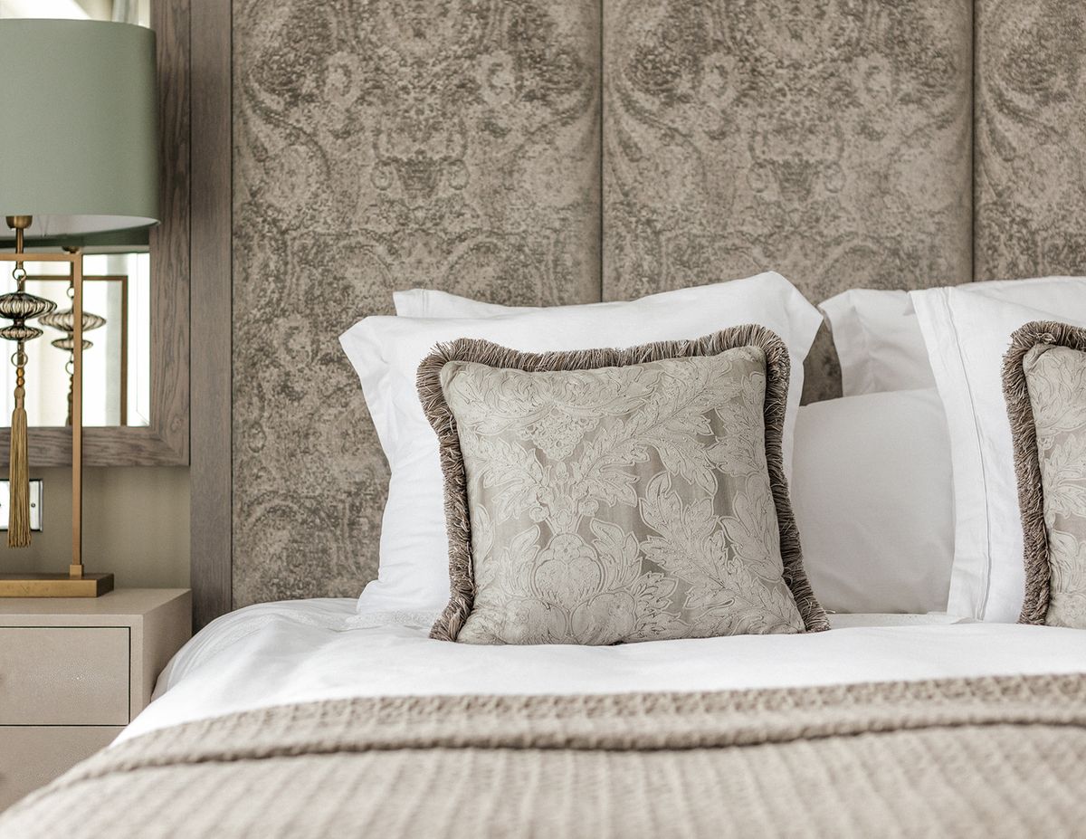 Bespoke cushion detail with damask fabric and tassel trim